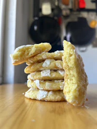 a stack of cookies with powdered sugar on top